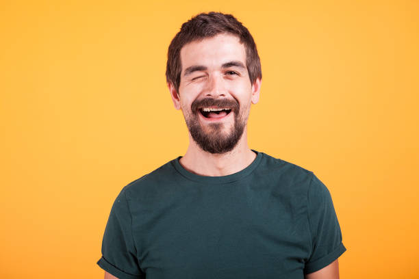 istock Happy positive man looking at the camera and winking 2180212962