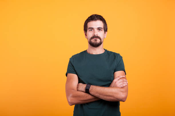 istock Serious man isolated on orange background 2180216327