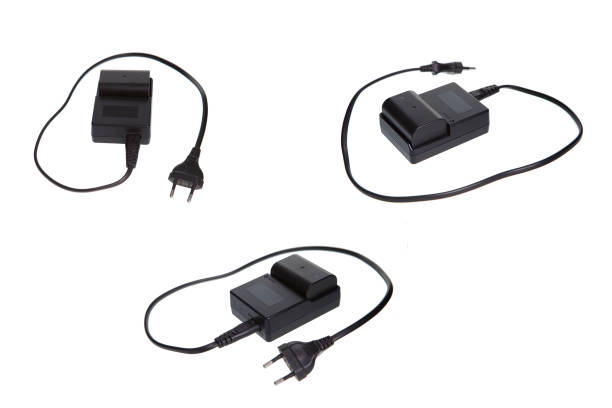 Battery camera charger on white background isolated. Modern rechargin tehnology