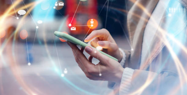 istock Young woman with smartphone in her hands. Outdoors. Global networking concept 2180217677