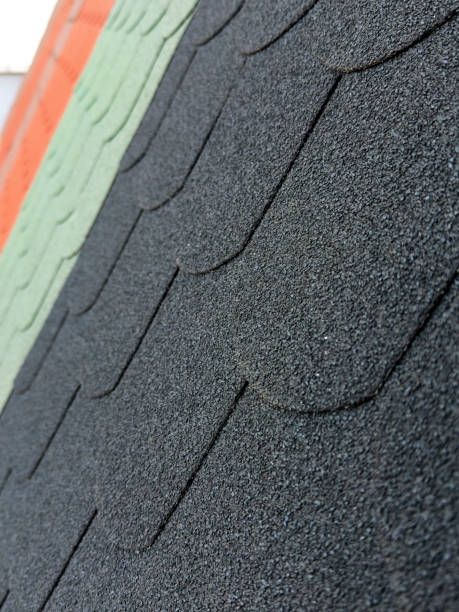 istock Close-up view of textured roofing shingles in various colors 2180219421