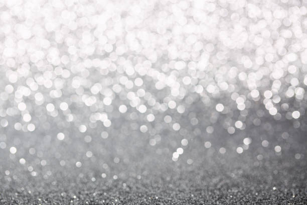 istock Metallic foil background. Shiny metal silver foil texture abstract defocused background. Sparkle glitter texture with bokeh lights. Holiday Christmas image. 2180219486