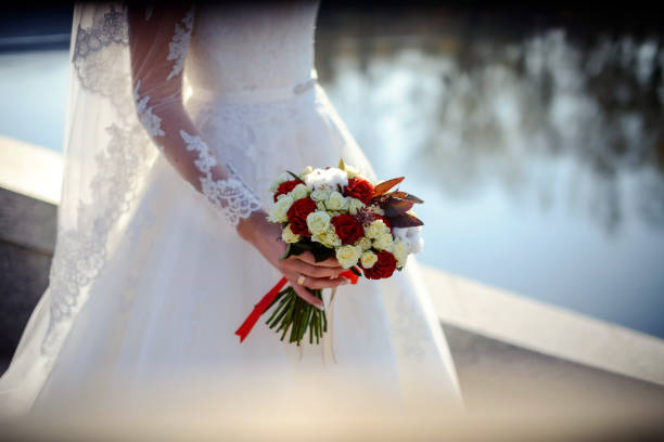 Bride holding bouquet in her hands.