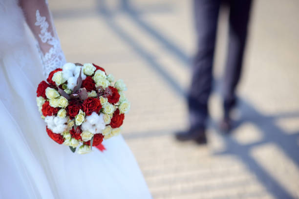 Wedding bouquet in hands of the bride.