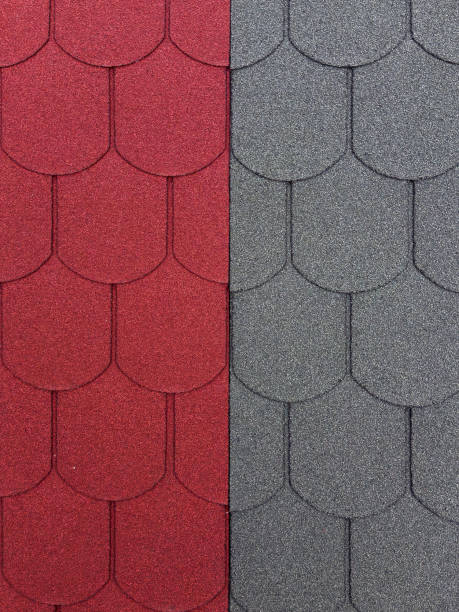 istock Textured roofing shingles display a contrasting design in red and gray colors 2180222748