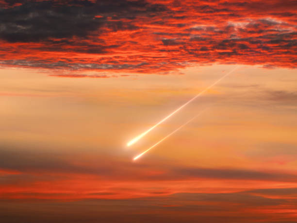 Shooting stars at sunset. Meteor trails in the evening sky. Bright meteorites isolated during the day.