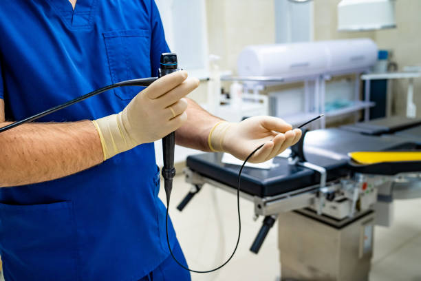 istock Doctor holds stethoscope in his hands in the operating room. 2180222898
