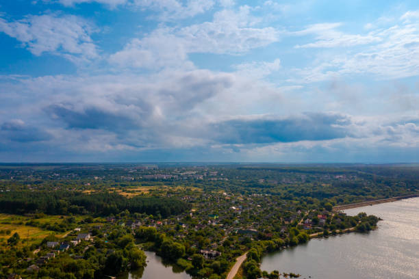 Beautiful landscape with river and village on the shore