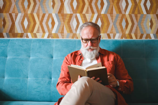 istock Front view portrait of mature man with book. 2180225335