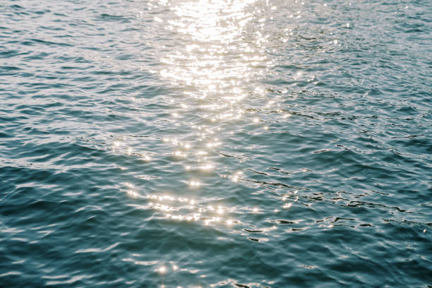 istock Blue sea sparkling in the bright sunlight 2180226226