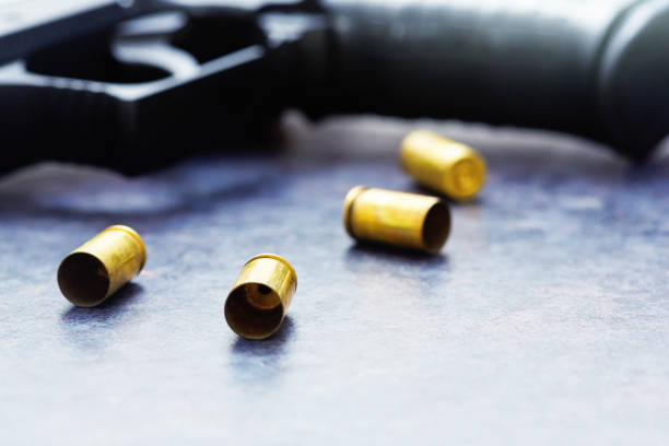 Spent cases with a handgun.