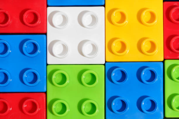 Close up of solid background with colored plastic blocks or bricks toy for building constructions. The concept of children's educational games. Image for your design