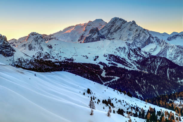 istock winter landscape in Passo Role before sunrise 2180232754