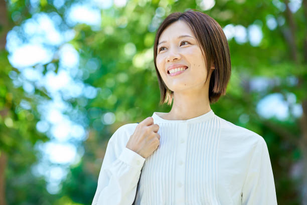 istock Woman walking in green space 2180233901