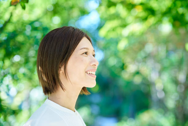 istock Smiling woman in the greenery 2180233937