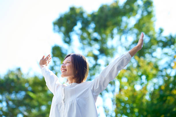istock Smiling woman in the greenery 2180233994
