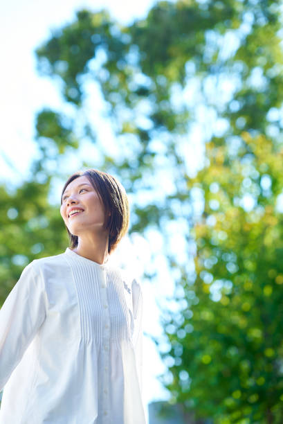 istock Smiling woman in the greenery 2180234014