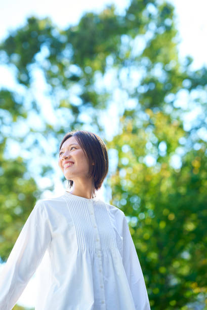 Smiling woman in the greenery