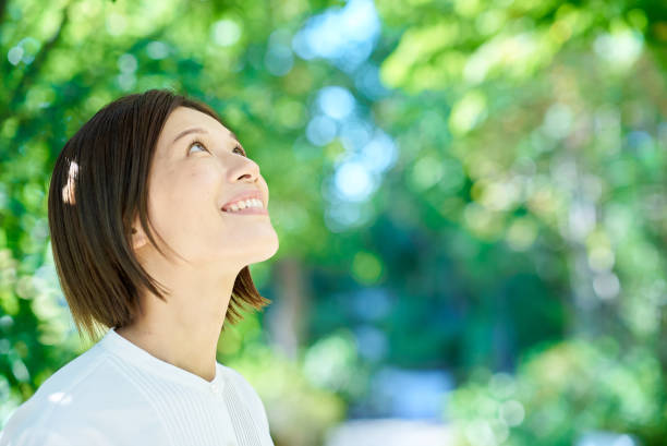 istock Smiling woman in the greenery 2180234126