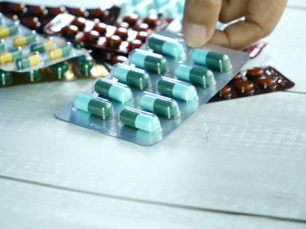 istock Hand holding a blister pack of antibiotics. 2180234233