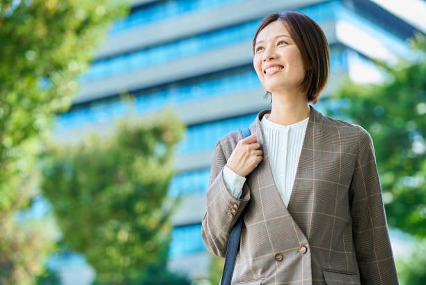 istock Asian woman commuting to work 2180235427