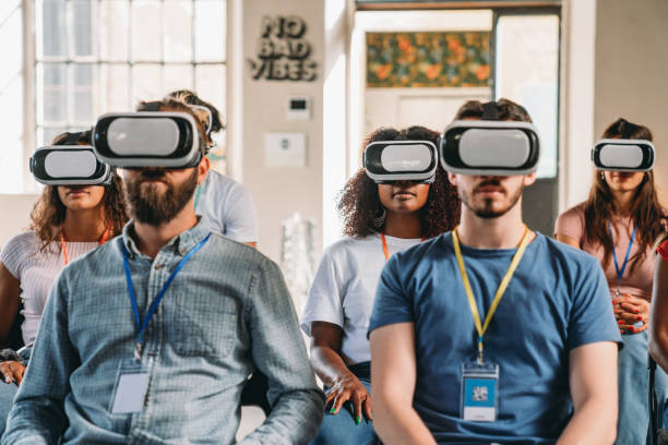 istock Group of people wearing virtual reality VR glasses during a virtual meeting 2180235565