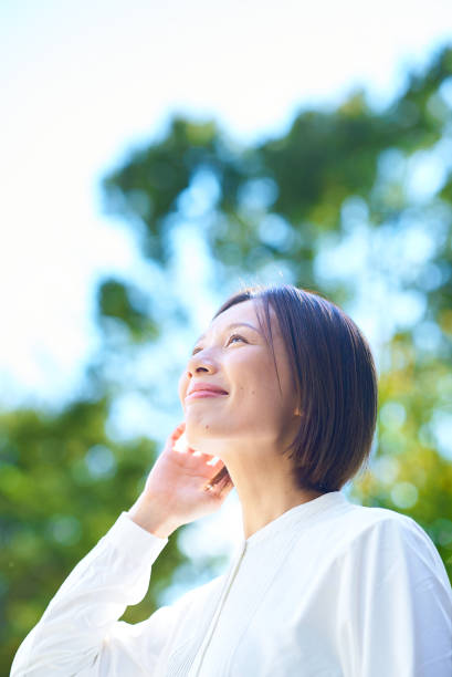 istock A woman relaxing in the greenery 2180235603