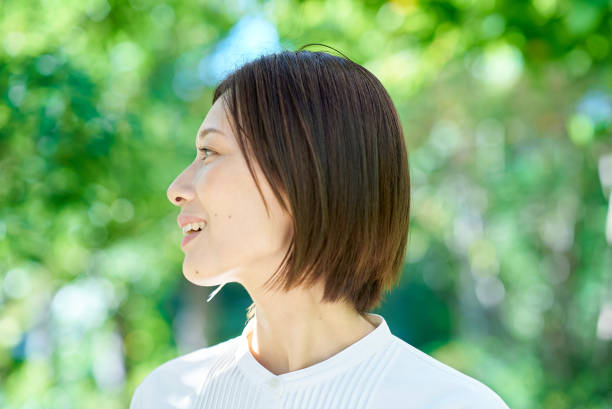 istock A woman relaxing in the greenery 2180235716