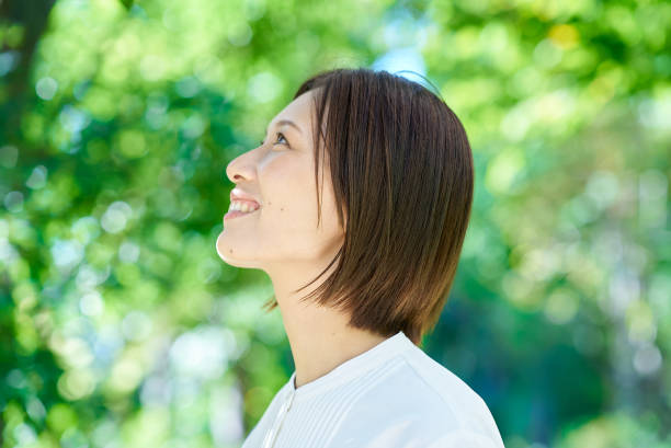 istock A woman relaxing in the greenery 2180235816