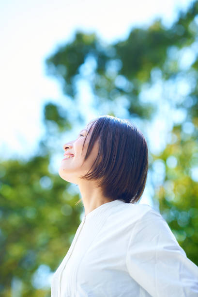 istock A woman relaxing in the greenery 2180236025