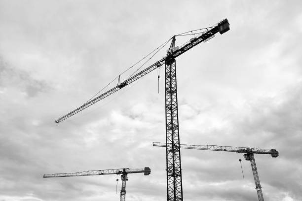 istock Industrial Construction Cranes Against a Cloudy Sky 2180237857