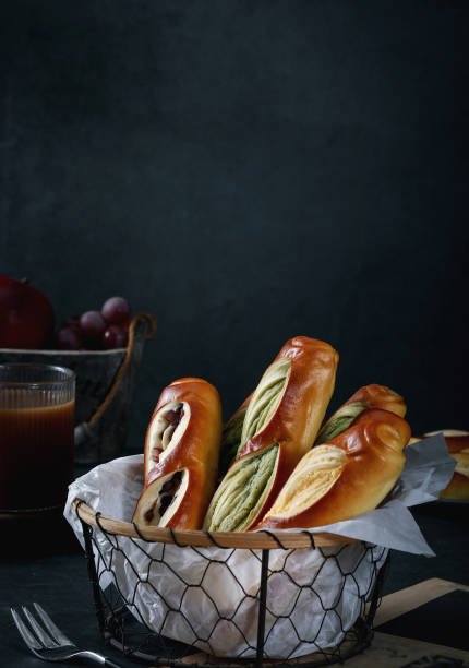 istock Baguette and lye bread on the table, top view, dark tabletop 2180237927