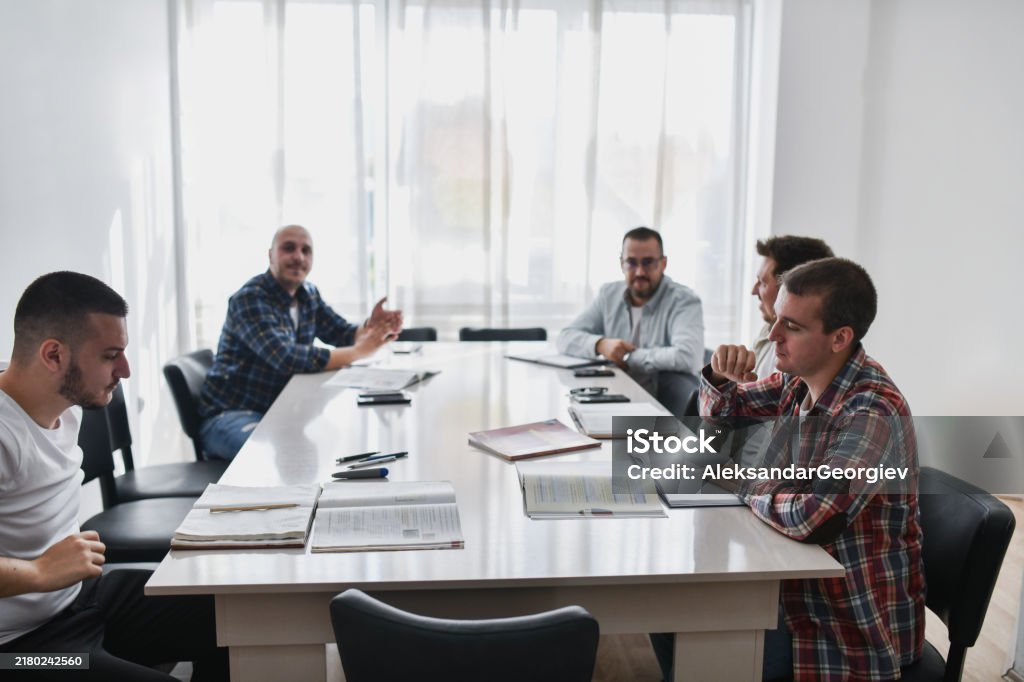 Debating Table Focused Male Colleagues Debating Solutions For Serious Work Problem ...