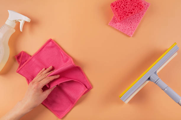 istock Set for cleaning windows and other surfaces on orange background 2180243286