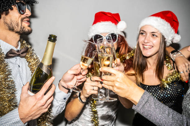 istock Group of friends joyously celebrating with festive decorations. 2180244953