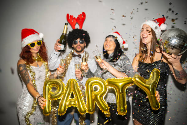 istock Exuberant holiday festivity with champagne and PARTY decor fun. 2180244991