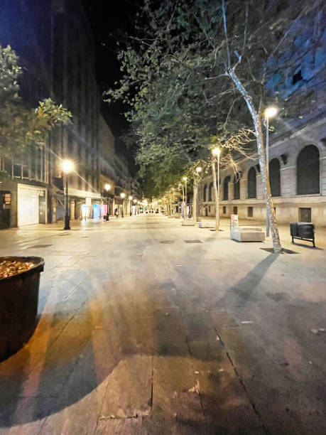 istock Moonlit Pathway: Barcelona’s Serene Night Street 2180245865
