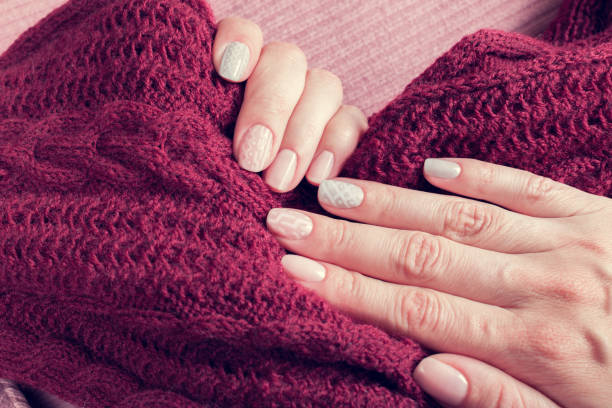 istock knitted texture manicure on nails from pink and gray colors 2180246322