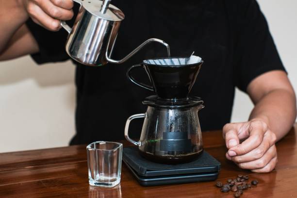 istock A man making a drip coffee or v60 method, pouring hot water from kettle over a ground coffee powder in the funnel 2180246834