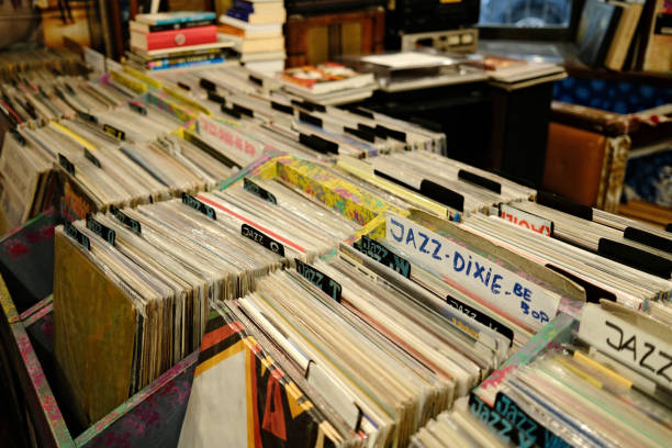 istock Browsing through a large collection of vinyl records in a record store 2180247654