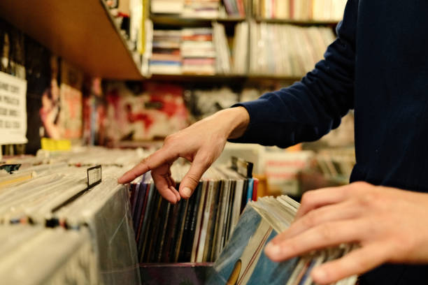 istock Customer choosing vinyl record in music store 2180247665
