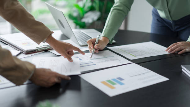 istock Alternative energy environment businesspeople checking document and brainstorm about future power 2180249572