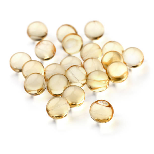 istock Vitamin D capsules close up on white background 2180252396