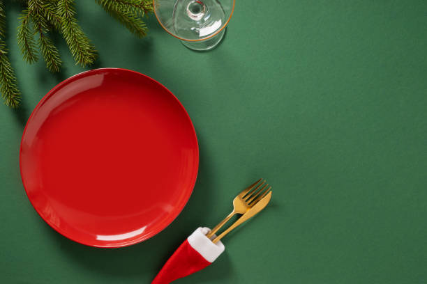 istock Christmas table setting with red empty plate on green. Xmas dinner. 2180252867