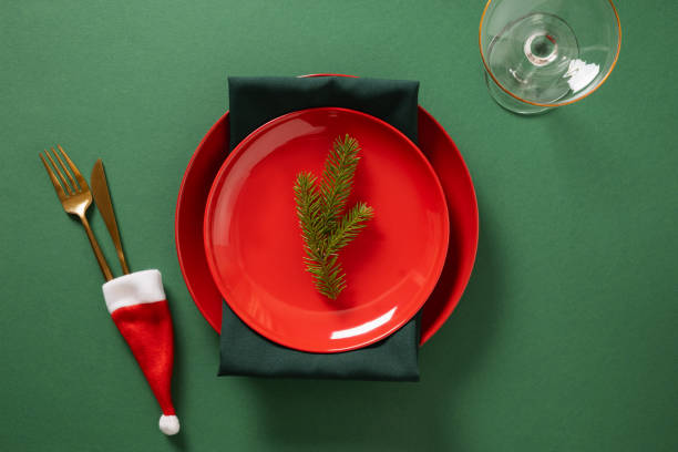 istock Christmas table setting with red plate on green. Xmas dinner. 2180252871