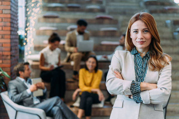 istock Confident businesswoman and her team. 2180253835