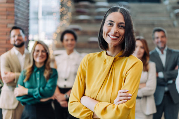 istock Confident businesswoman and her team. 2180253882