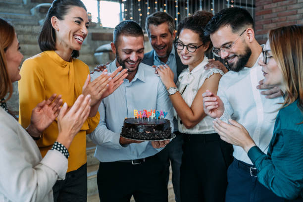 istock Team celebrating a birthday at the office. 2180253945