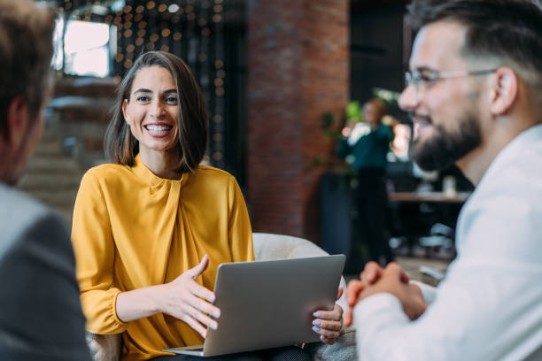istock Group of business persons talking in the office. 2180253955