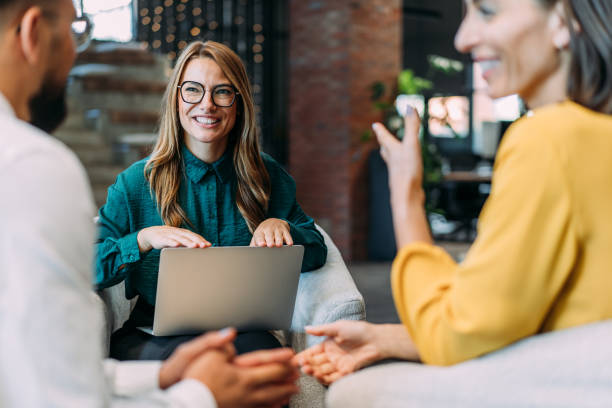 istock Group of business persons talking in the office. 2180253961